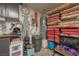 Close up of garage storage with shelves of cushions and other items, with hot water tank at 1441 Palm Dr, Laughlin, NV 89029