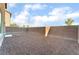 Large backyard area featuring full fencing, providing privacy and security, ready for landscaping at 1512 Groom Ave, North Las Vegas, NV 89081