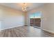 The dining area features sliding glass door to the backyard and modern chandelier at 1512 Groom Ave, North Las Vegas, NV 89081