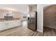 Spacious kitchen showcasing stainless steel refrigerator and a walk-in pantry at 1512 Groom Ave, North Las Vegas, NV 89081