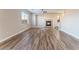 Open-concept living room featuring wood-look flooring and modern fireplace at 1512 Groom Ave, North Las Vegas, NV 89081