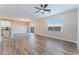 Open-concept living room featuring wood-look flooring, sliding glass doors, and great natural light at 1512 Groom Ave, North Las Vegas, NV 89081