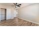 Main bedroom features wood-look flooring, closet space, and convenient access to the ensuite bathroom at 1512 Groom Ave, North Las Vegas, NV 89081