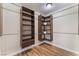 Spacious walk-in closet with wood look floors and shelving at 1512 Groom Ave, North Las Vegas, NV 89081