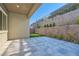 Back patio with stone pavers and a synthetic lawn area with a built-in putting green at 157 Sarabeth St, Las Vegas, NV 89138