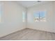 Bedroom featuring light colored wood floors and natural light from plantation shutter windows at 157 Sarabeth St, Las Vegas, NV 89138