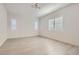 Bright bedroom with light colored wood floors and natural light from multiple windows at 157 Sarabeth St, Las Vegas, NV 89138