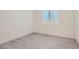 Bedroom featuring light colored wood floors and natural light from a plantation shutter window at 157 Sarabeth St, Las Vegas, NV 89138