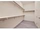 Walk-in closet with open shelving and clothing rods at 157 Sarabeth St, Las Vegas, NV 89138