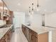 Stylish kitchen featuring a large island with granite countertops, stainless steel appliances, and pendant lighting at 157 Sarabeth St, Las Vegas, NV 89138