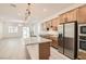 Gourmet kitchen featuring a large island, stainless steel appliances, and an open-concept design at 157 Sarabeth St, Las Vegas, NV 89138