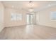 Bright living room with wood floors, recessed lighting, and sliding glass door to outside at 157 Sarabeth St, Las Vegas, NV 89138