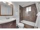Bathroom featuring vanity with sink, toilet, tub, and shower at 1628 Patricia St, North Las Vegas, NV 89030