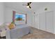 Cozy bedroom showcasing a large window and double closets at 1628 Patricia St, North Las Vegas, NV 89030