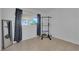 Bright exercise room with pull-up bar and large mirror at 1628 Patricia St, North Las Vegas, NV 89030