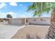 Inviting single-story house with a neat front yard, featuring mature landscaping and a driveway at 1628 Patricia St, North Las Vegas, NV 89030