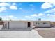 Charming single-story home with a well-maintained front yard and a two-car garage at 1628 Patricia St, North Las Vegas, NV 89030
