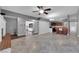 Open-concept living area with tile floors, modern lighting, and seamless flow to the kitchen at 1628 Patricia St, North Las Vegas, NV 89030