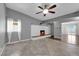 Cozy living room with a fireplace, tile floors, and natural light from nearby windows at 1628 Patricia St, North Las Vegas, NV 89030