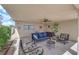 Spacious covered patio with comfortable seating and outdoor ceiling fan at 1628 Patricia St, North Las Vegas, NV 89030