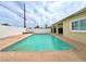 Inviting in-ground pool surrounded by a spacious patio, perfect for summer days and entertaining at 1628 Patricia St, North Las Vegas, NV 89030