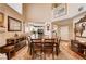 Cozy dining area featuring unique decor, wood floors and natural light at 1721 Derbyshire Dr, Las Vegas, NV 89117