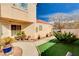 Cozy home showcasing desert landscaping, artificial turf, and an inviting walkway at 1721 Derbyshire Dr, Las Vegas, NV 89117
