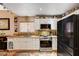 Updated kitchen with granite countertops, stainless steel appliances, and ample cabinetry at 1721 Derbyshire Dr, Las Vegas, NV 89117