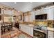 Open kitchen design with stainless steel appliances, granite counters, and breakfast bar at 1721 Derbyshire Dr, Las Vegas, NV 89117