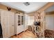 Charming kitchen area with custom shelving, cabinetry, and a delightful breakfast nook at 1721 Derbyshire Dr, Las Vegas, NV 89117