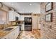 Bright and efficient kitchen featuring granite countertops and stainless steel appliances at 1721 Derbyshire Dr, Las Vegas, NV 89117