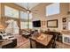 Open-concept living area featuring vaulted ceilings, natural light, and stylish furnishings at 1721 Derbyshire Dr, Las Vegas, NV 89117