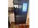 Modern stainless steel refrigerator with a built-in screen, complementing the kitchen design at 1721 Derbyshire Dr, Las Vegas, NV 89117
