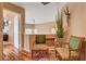 Upstairs sitting area featuring two decorative chairs, hard wood flooring, and accent lighting at 1721 Derbyshire Dr, Las Vegas, NV 89117