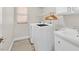 Well-lit laundry room includes washer, dryer, sink and storage space for added convenience at 1808 Michael Ct, Henderson, NV 89014