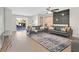 Open-concept living room includes hardwood floors, a gray leather sofa, and access to the backyard at 1808 Michael Ct, Henderson, NV 89014