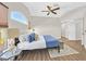 Bright, airy main bedroom showcasing vaulted ceiling, ceiling fan, and comfortable furnishings at 1808 Michael Ct, Henderson, NV 89014