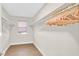Ample walk-in closet with wood floors, adjustable shelving and natural light for organization at 1808 Michael Ct, Henderson, NV 89014