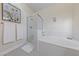 Elegant bathroom with tiled shower, soaking tub, and neutral-toned walls at 2050 W Warm Springs Rd # 224, Henderson, NV 89014