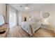 Bright bedroom with a chandelier, TV, walk-in closet, and a decorative mirror at 2050 W Warm Springs Rd # 224, Henderson, NV 89014