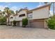 Exterior features driveways and garages with palm tree landscaping at 2050 W Warm Springs Rd # 224, Henderson, NV 89014