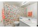 Bright bathroom features a floral shower curtain, vanity, and stylish accents at 2080 Silver Breeze Ave, Las Vegas, NV 89183