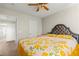 Bedroom with a tufted headboard, neutral carpet and closet access at 2080 Silver Breeze Ave, Las Vegas, NV 89183