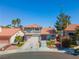 Charming two-story home with a well-maintained front yard and lovely landscaping at 2080 Silver Breeze Ave, Las Vegas, NV 89183