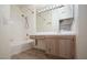 Well-lit bathroom featuring a shower over tub and neutral vanity with plenty of storage at 2110 Los Feliz St # 1034, Las Vegas, NV 89156