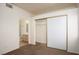 Bedroom with neutral carpet and closet with sliding doors; bathroom access visible at 2110 Los Feliz St # 1034, Las Vegas, NV 89156