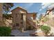 Apartment building exterior with stairs and desert landscaping at 2110 Los Feliz St # 1034, Las Vegas, NV 89156