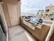 Condo balcony with view of the parking lot and desert landscape in the background at 2160 Highpointe Dr # 102, Laughlin, NV 89029