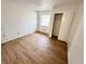 Bedroom with clean walls, window, wood floors, and closet at 2160 Highpointe Dr # 102, Laughlin, NV 89029