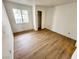 Bedroom with clean walls, window, and wood floors at 2160 Highpointe Dr # 102, Laughlin, NV 89029